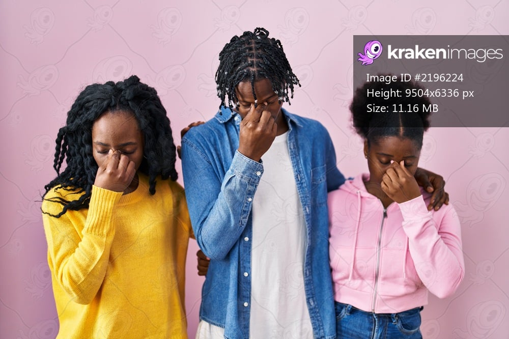 Group of three young black people standing together over pink background tired rubbing nose and eyes feeling fatigue and headache. stress and frustration concept. 