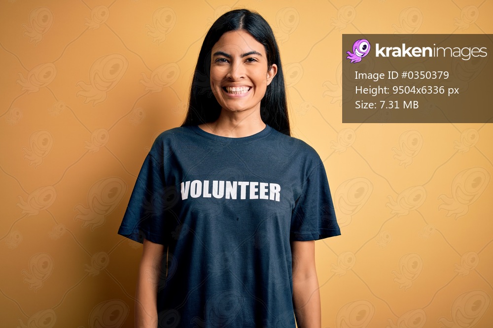 Young beautiful hispanic woman wearing volunteer t-shirt as social charity moral with a happy and cool smile on face. Lucky person.