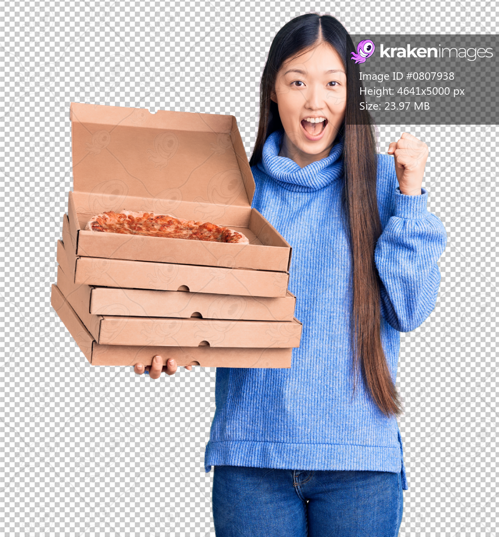 Young beautiful chinese woman holding cardboard boxes of italian pizza screaming proud, celebrating victory and success very excited with raised arms