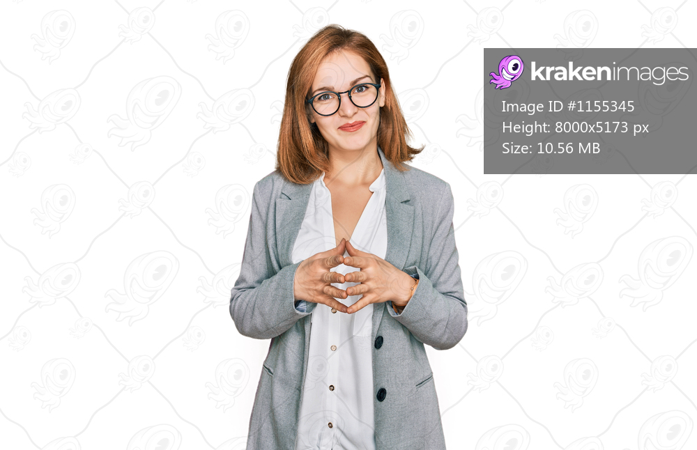 Young caucasian woman wearing business style and glasses hands together and fingers crossed smiling relaxed and cheerful. success and optimistic 