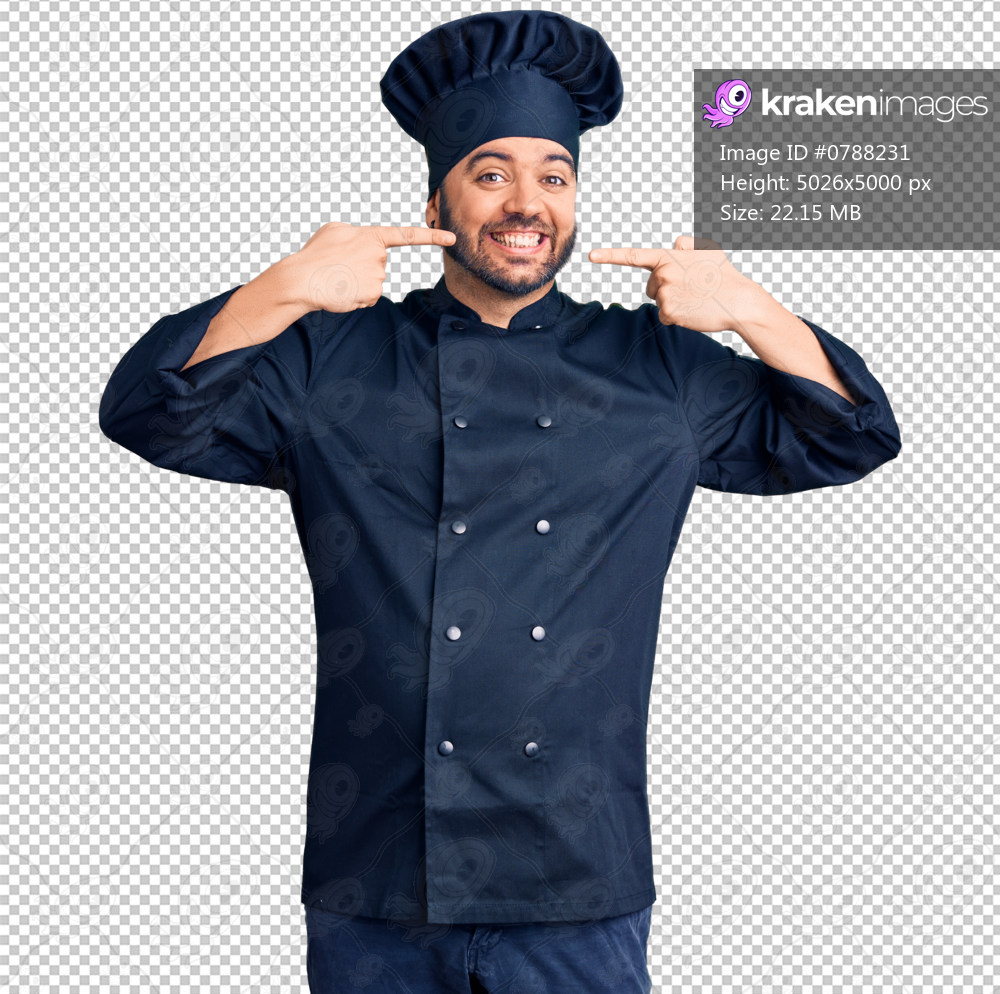 Young hispanic man wearing cooker uniform smiling cheerful showing and pointing with fingers teeth and mouth. dental health concept.