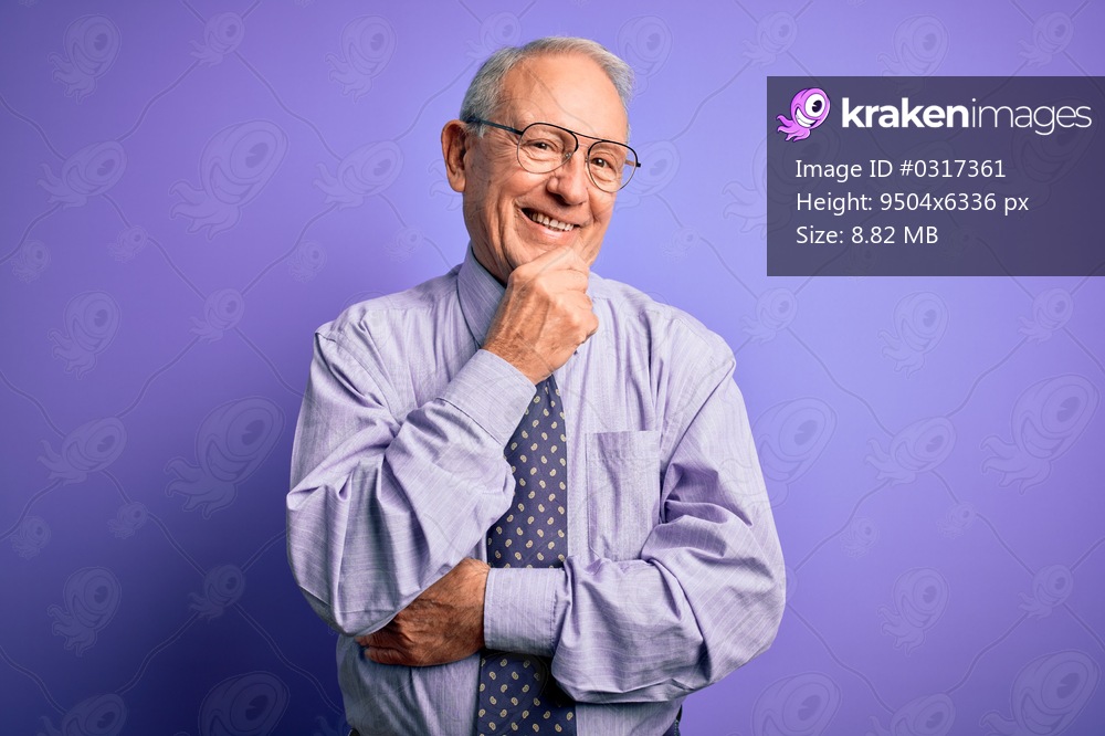Grey haired senior business man wearing glasses standing over purple isolated background looking confident at the camera with smile with crossed arms and hand raised on chin. Thinking positive.