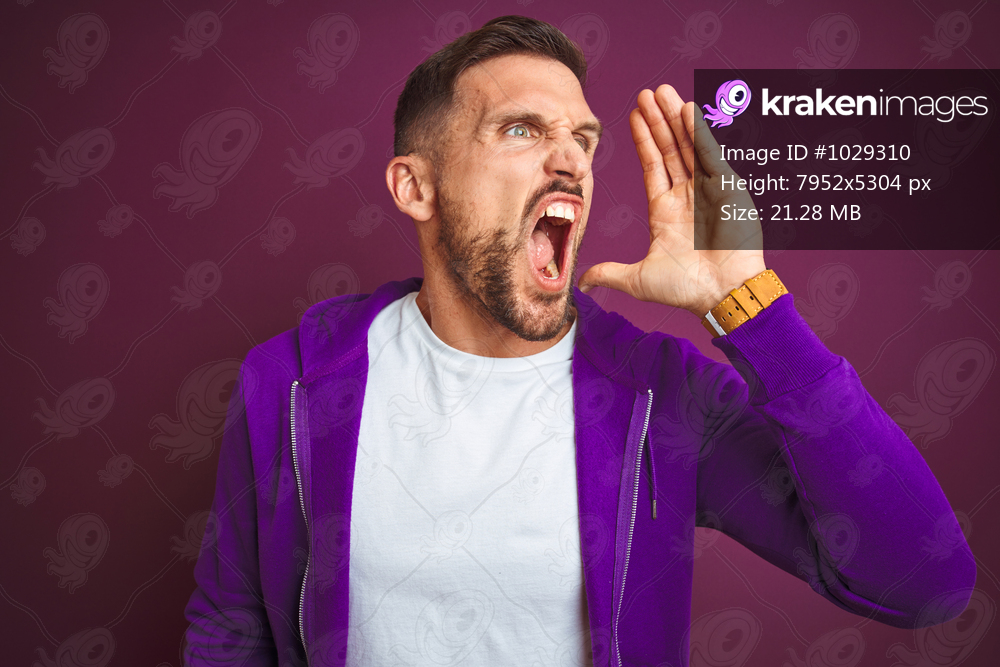 Young fitness man wearing casual sports sweatshirt over purple isolated background shouting and screaming loud to side with hand on mouth. Communication concept.