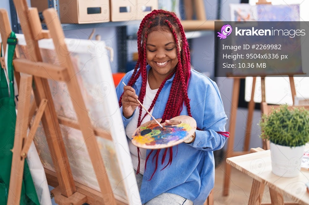 African american woman artist smiling confident drawing at art studio