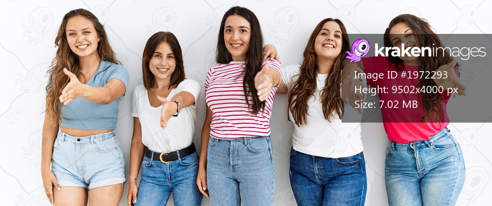 Group of women wearing casual clothes standing over isolated background smiling friendly offering handshake as greeting and welcoming. successful business. 
