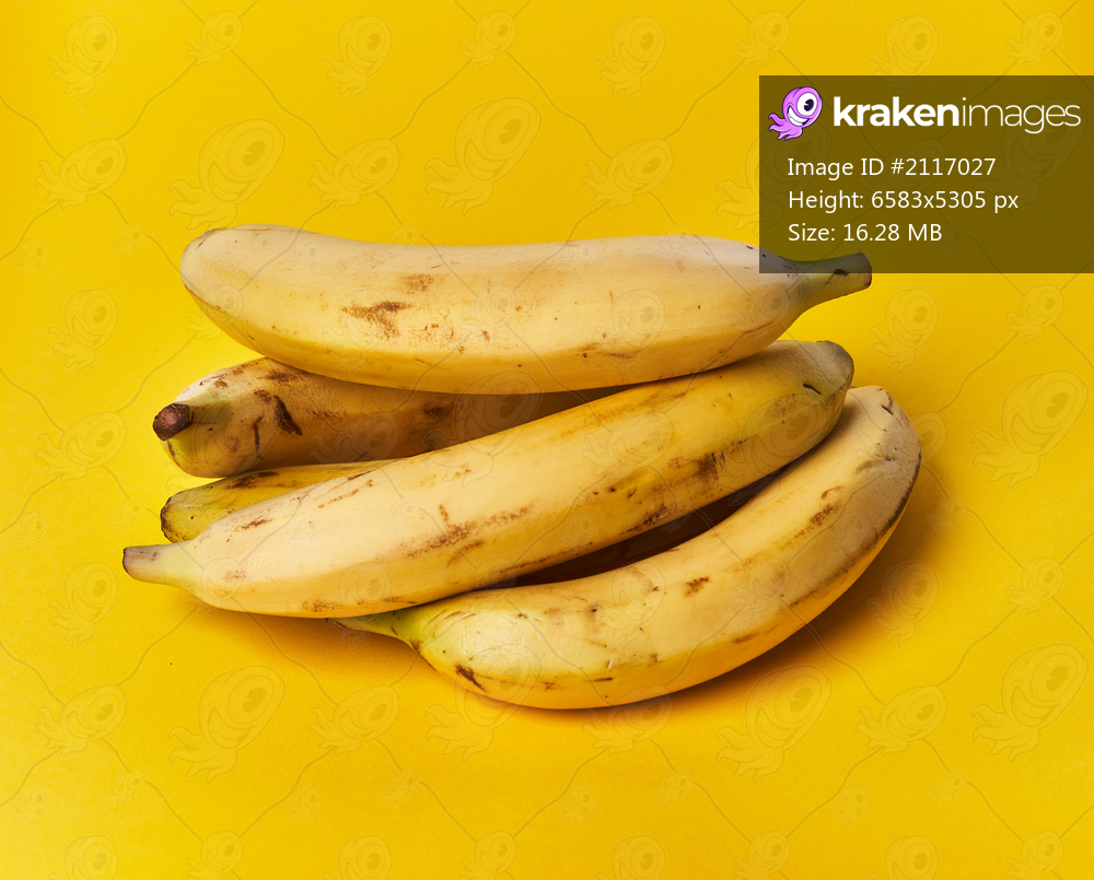  Bunch of bananas on a yellow background